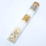 A glass tube containing layered bath salts