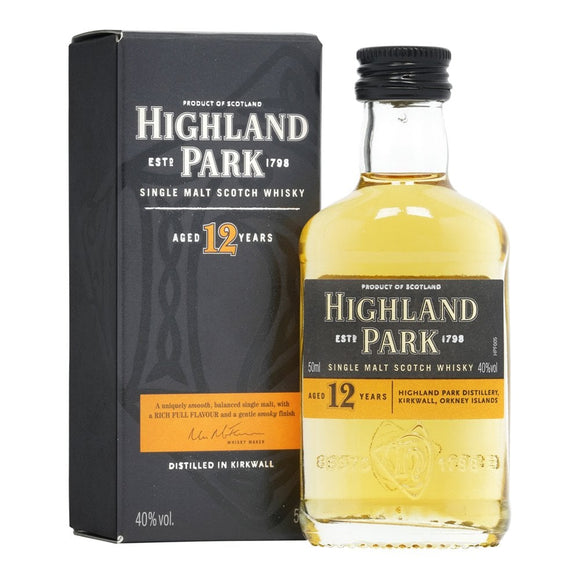 A 50ml bottle of single malt Highland Parky Scotch whisky next to its display box