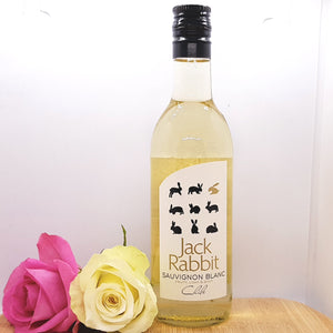 A bottle of Jack Rabbit Sauvignon Blanc decorated with two flowers
