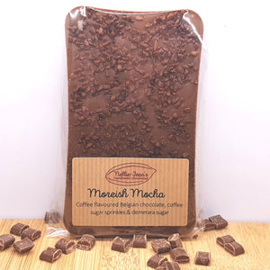 A slab of handmade coffee flavoured Belgian chocolate with coffee sugar sprinkles in a labelled wrapper