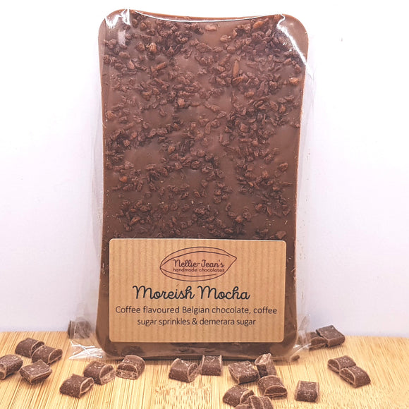 A slab of handmade coffee flavoured Belgian chocolate with coffee sugar sprinkles in a labelled wrapper