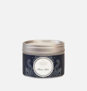 A clean slate fragrant candle in a tin with the lid on